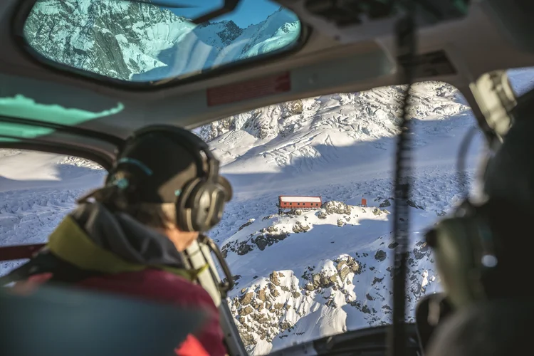 View through the front window of a helicopter on a private ride to Aoraki Mount Cook in Canterbury, New Zealand.