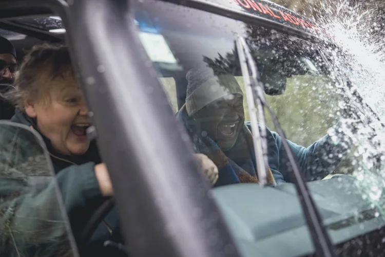 A senior woman on a thrilling off-roading UTV ride in Queenstown, New Zealand.