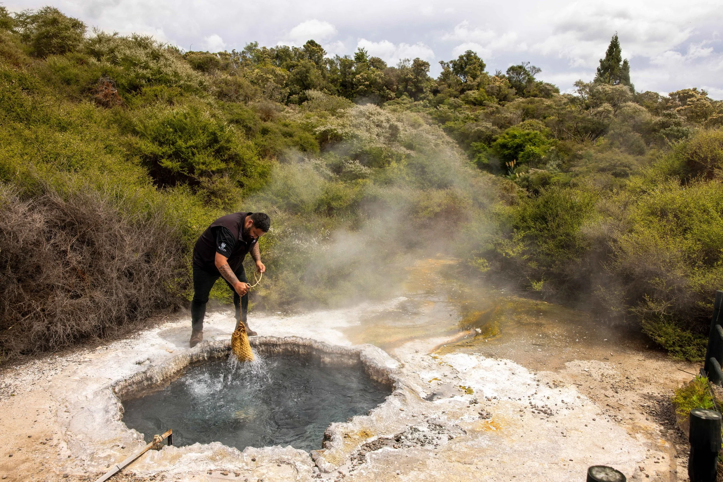 A traditional Māori hangi uses the geothermal heat of Rotorua hot springs in the Bay of Plenty, New Zealand, to cook food underground