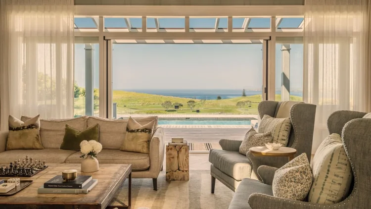 Elegant private suite designed for families at The Lodge at Kauri Cliffs in Northland, New Zealand, featuring luxurious furnishings, spacious living areas, and views of the surrounding coastal landscape.