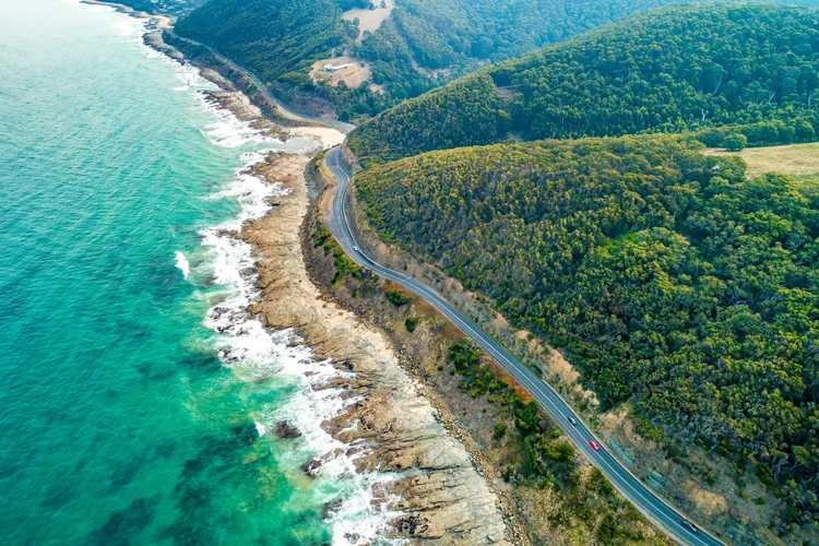 Aerial view of cars driving on the Great Ocean Road, Victoria, Australia.