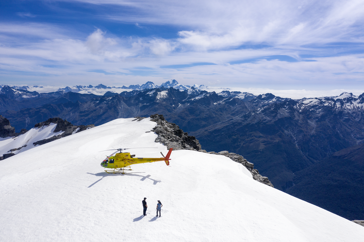 A couple at a viewpoint in the Southern Alps in Queenstown, New Zealand, that’s only accessible by private helicopter ride. 
