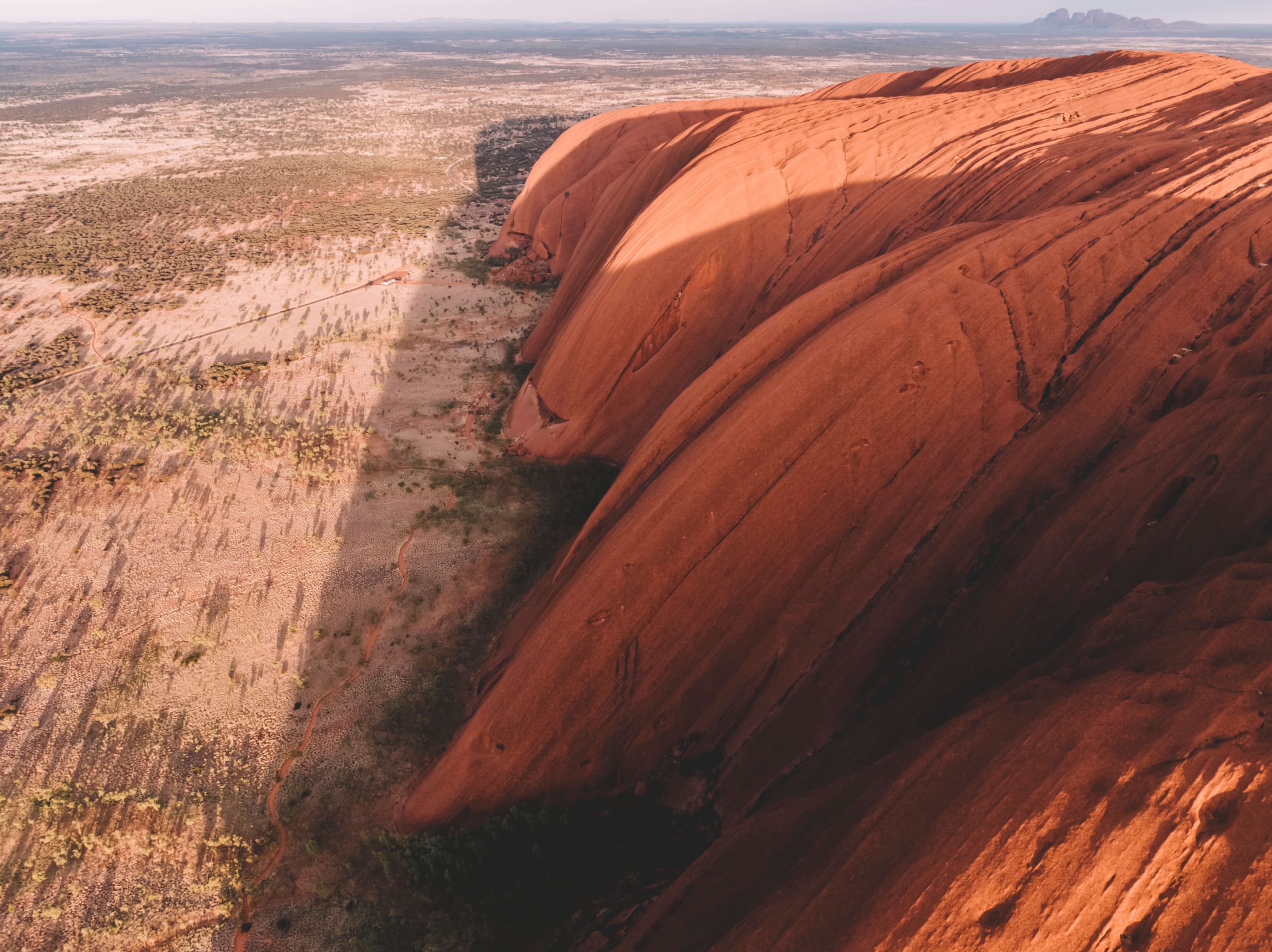 Aerial view of Uluru (also known as Ayers Rock), a massive sandstone monolith located in the heart of Australia's Northern Territory.